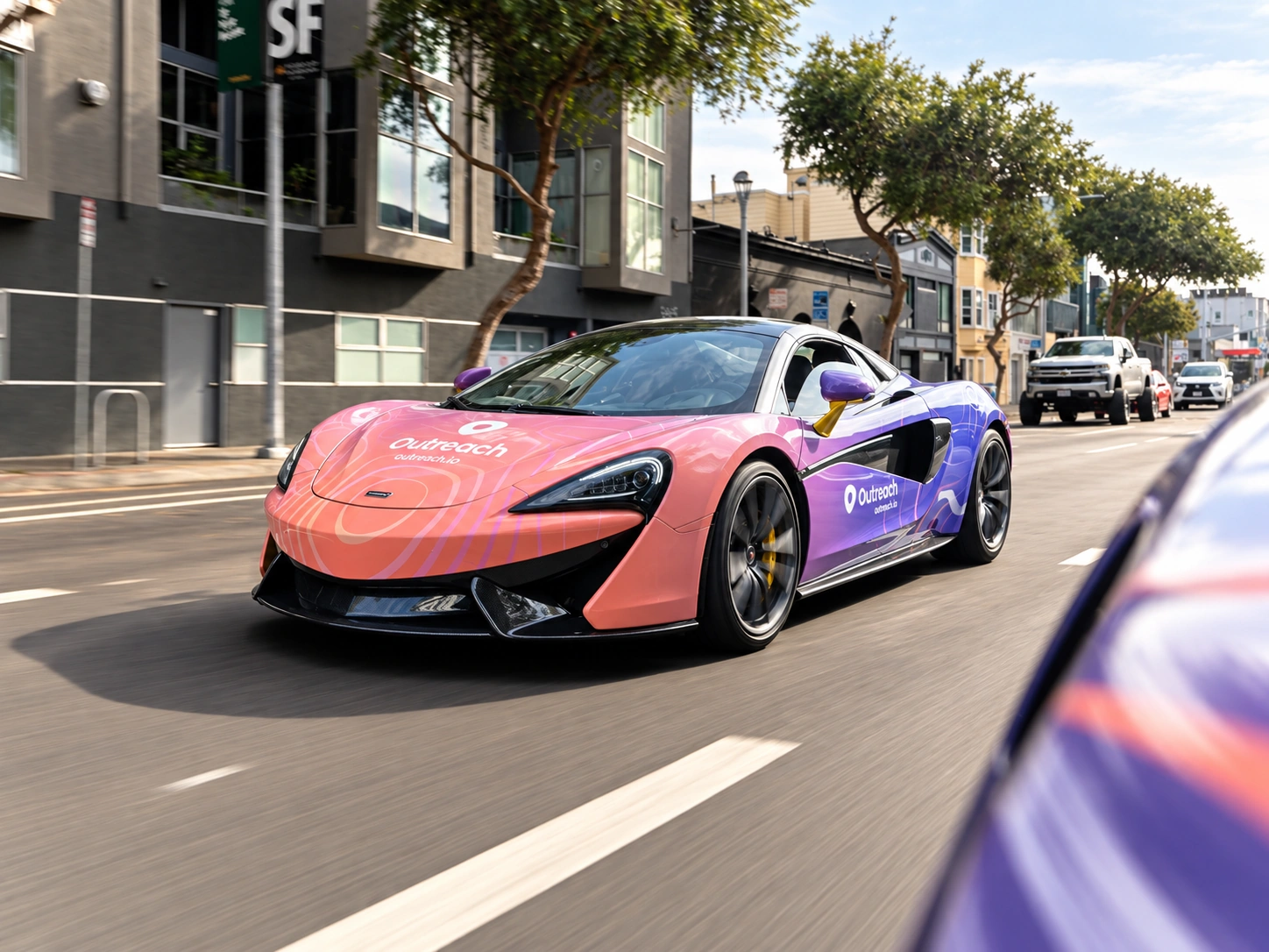 Outreach-wrapped McLaren driving through the city